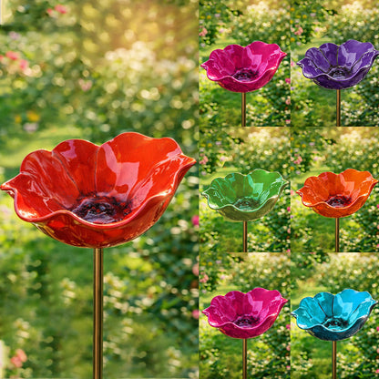 Collage of colorful glass bird baths on stakes with a garden background.